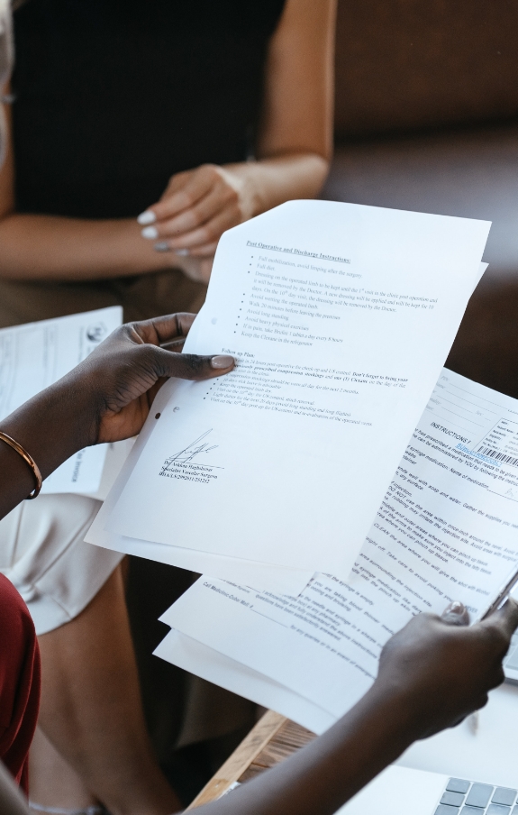 woman looking over documents on strategy and analysis